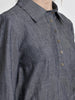 Placket close up view of a female model wearing a long sleeve denim dress. From the RÉZO women's collection.